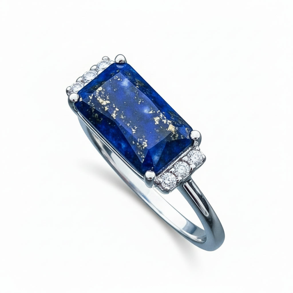 Landscape lapis lazuli gemstone framed in sterling silver showcasing the stone’s deep celestial blue flecked with natural golden pyrite