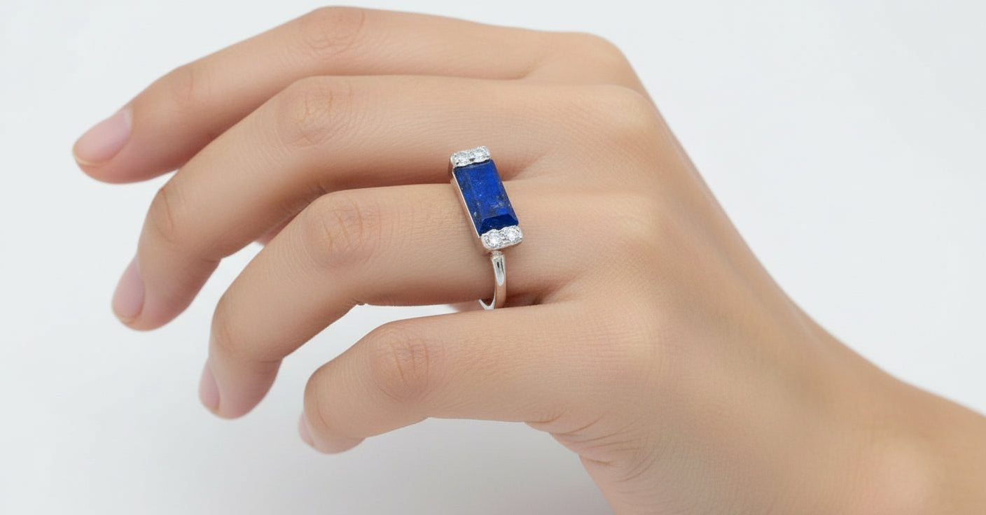 Landscape lapis lazuli gemstone framed in sterling silver showcasing the stone’s deep celestial blue flecked with natural golden pyrite