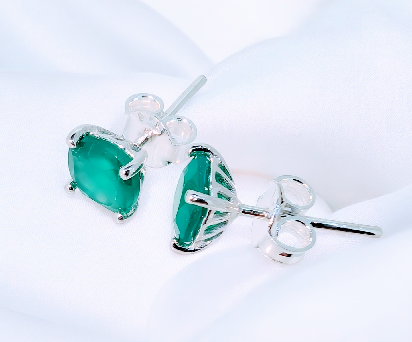 Petite green onyx gemstone sterling silver stud earrings offer a striking pop of colour