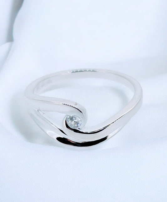 Sterling Silver Breaking Wave Ring - cresting tide cradling a cut zirconia at its peak on this sterling silver ring.